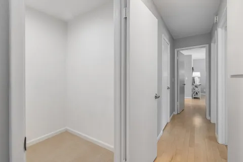 a view of a bathroom from a hallway