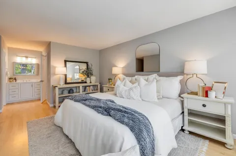 a bedroom with a bed and a couch