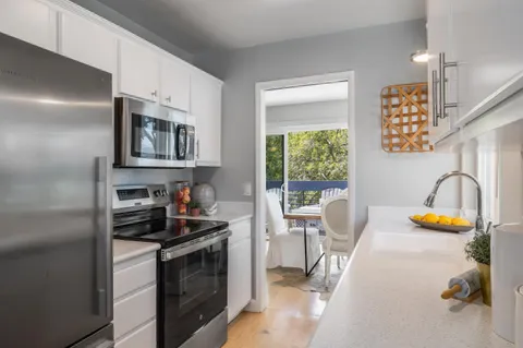 a kitchen with a stove and a sink