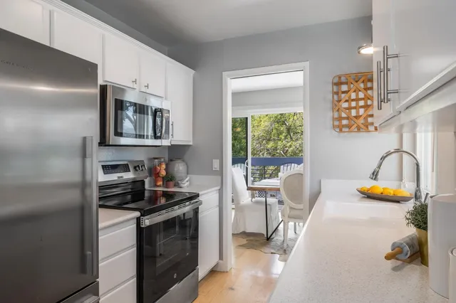 a kitchen with a stove and a sink