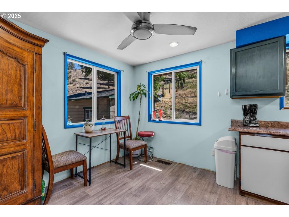 4800 Mill Creek Road Prineville, OR 97754 - Photo 11 of 40 a workspace with furniture window and wooden floor