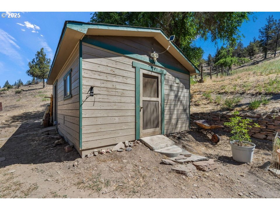 4800 Mill Creek Road Prineville, OR 97754 - Photo 22 of 40 a view of a house with a yard