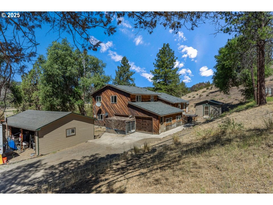 4800 Mill Creek Road Prineville, OR 97754 - Photo 25 of 40 a view of a house with a yard