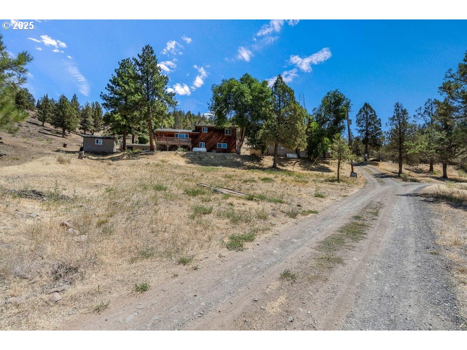 4800 Mill Creek Road Prineville, OR 97754 - Photo 28 of 40 a view of a backyard of a house