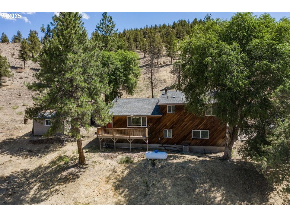 4800 Mill Creek Road Prineville, OR 97754 - Photo 35 of 40 a view of a house with a yard