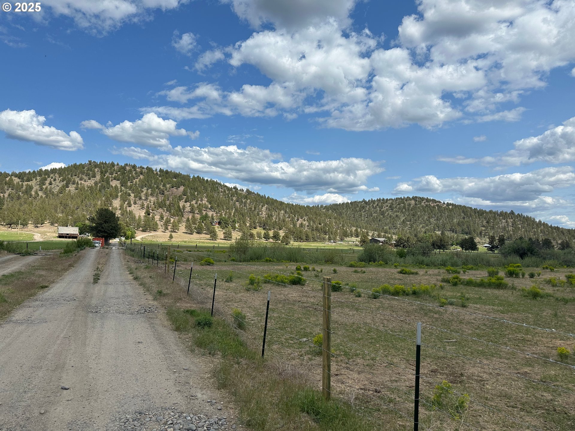 4800 Mill Creek Road Prineville, OR 97754 - Photo 4 of 40 a view of a lake with a yard