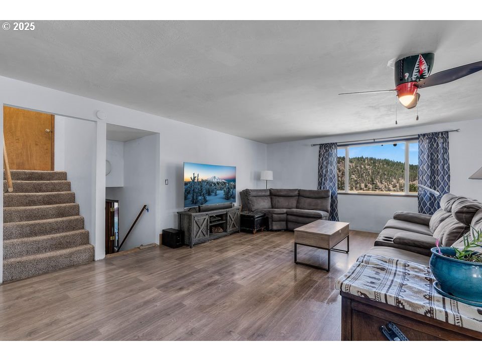 4800 Mill Creek Road Prineville, OR 97754 - Photo 8 of 40 a living room with furniture and a wooden floor