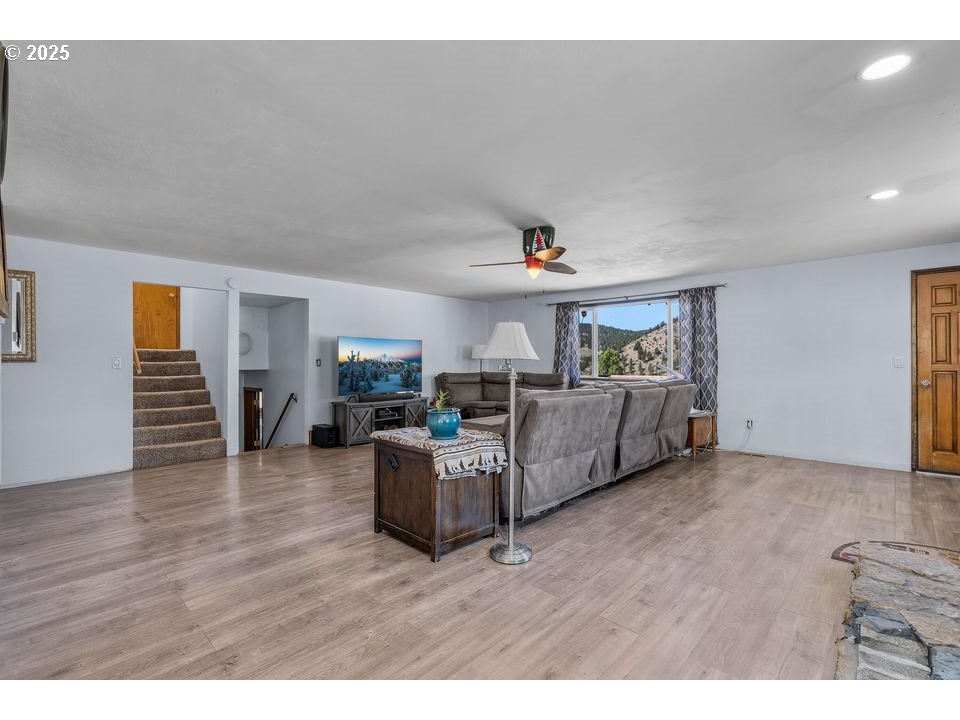 4800 Mill Creek Road Prineville, OR 97754 - Photo 9 of 40 a living room with furniture and a wooden floor