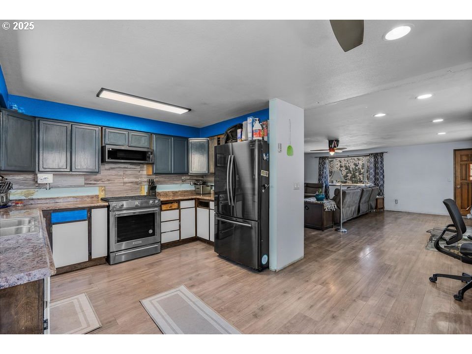 4800 Mill Creek Road Prineville, OR 97754 - Photo 10 of 40 a kitchen with a refrigerator and a sink