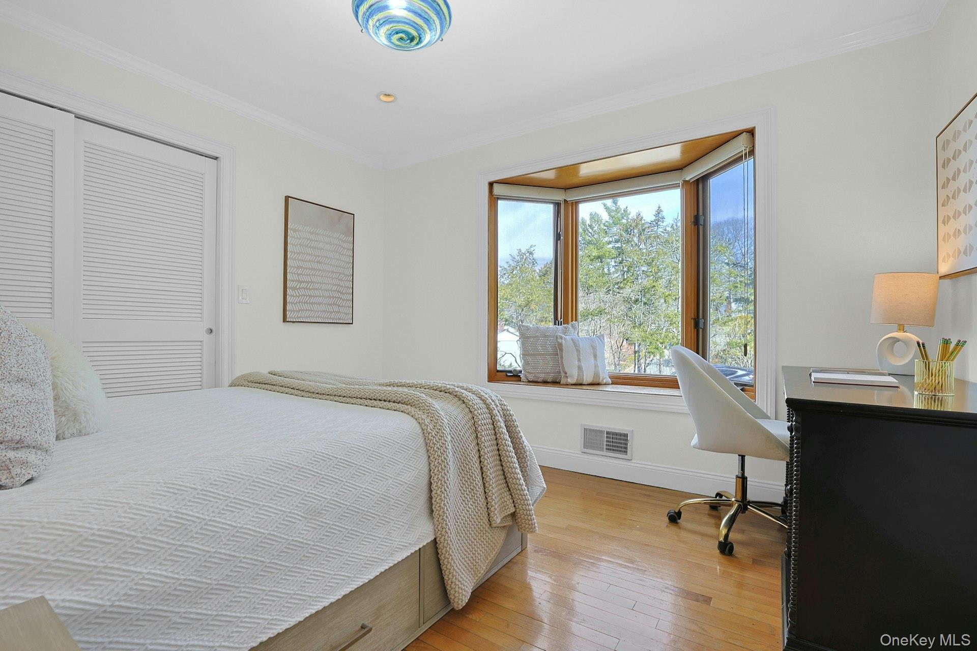 45 Sprain Valley Road Scarsdale, NY 10583 - Photo 13 of 26 First of two additional main-level bedrooms, featuring a charming bay window and a large outfitted closet.
