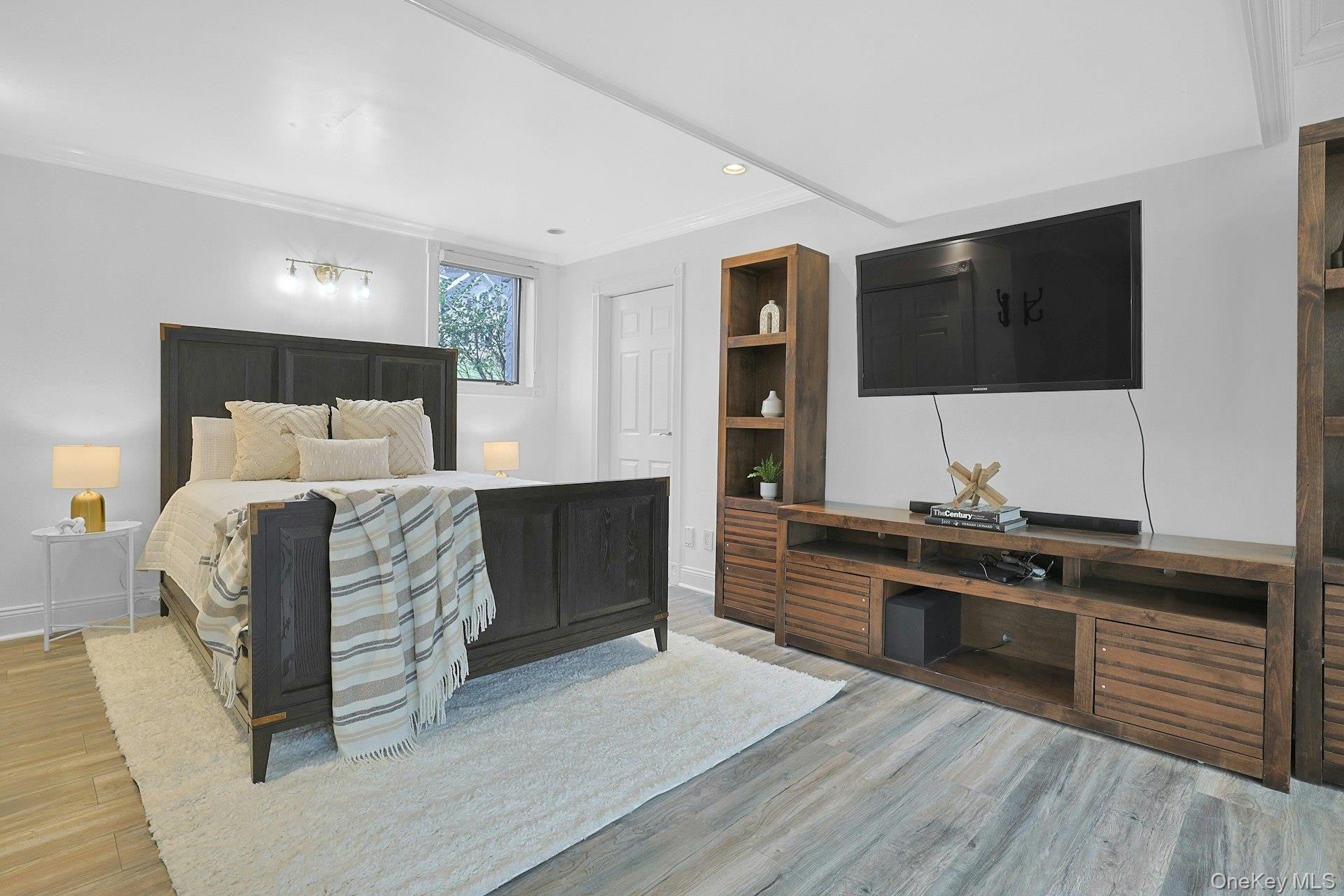 45 Sprain Valley Road Scarsdale, NY 10583 - Photo 16 of 26 Versatile large ensuite lower level bedroom with sliding door to lower level stone covered patio.