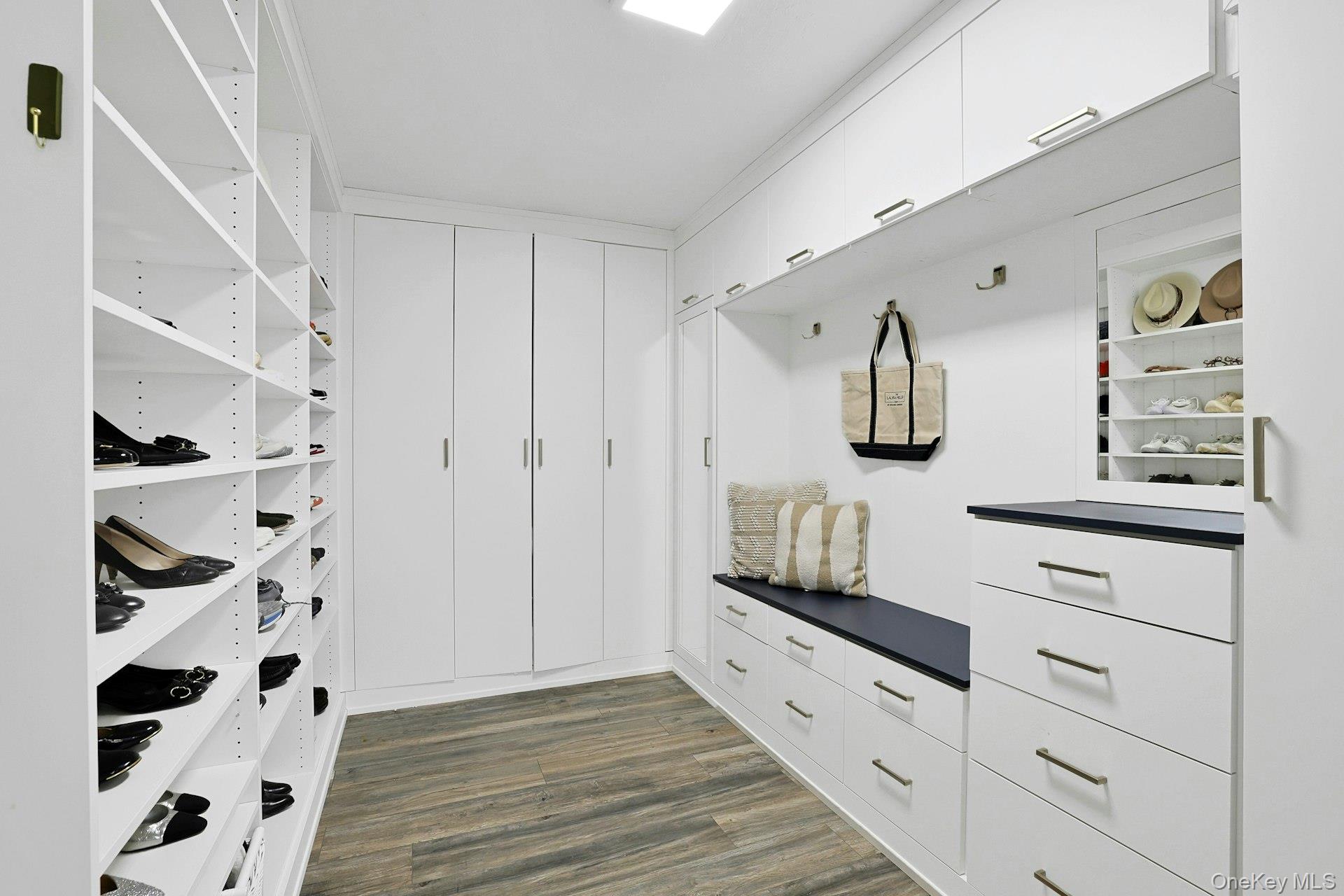 45 Sprain Valley Road Scarsdale, NY 10583 - Photo 20 of 26 Generous mudroom thoughtfully outfitted with custom closets, open shelving, and integrated drawers for streamlined everyday organization.