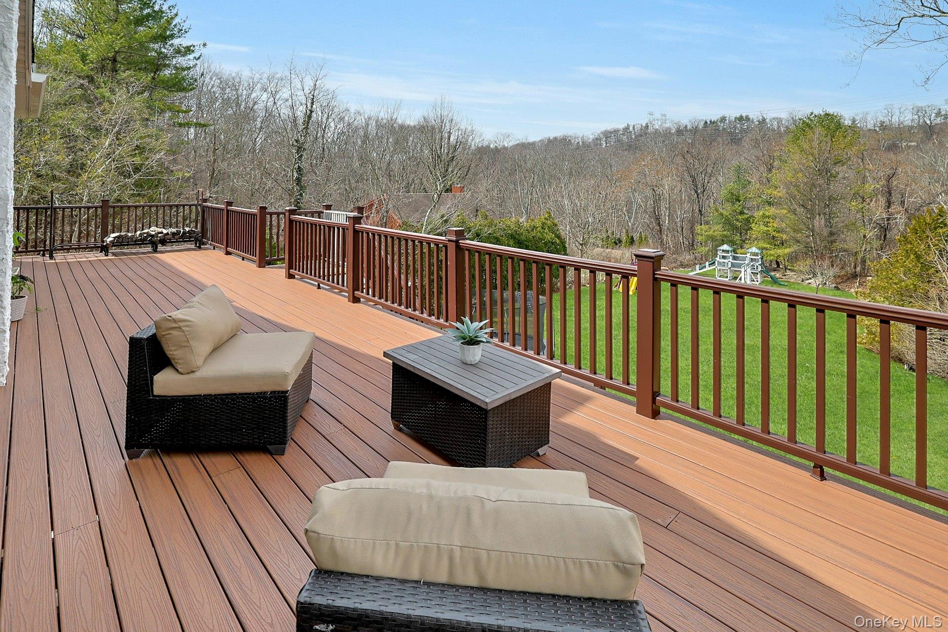 45 Sprain Valley Road Scarsdale, NY 10583 - Photo 23 of 26 Oversized deck, perfect for outdoor entertaining or simply relaxing, overlooking the expansive property with elevated views of the surrounding lush landscape.