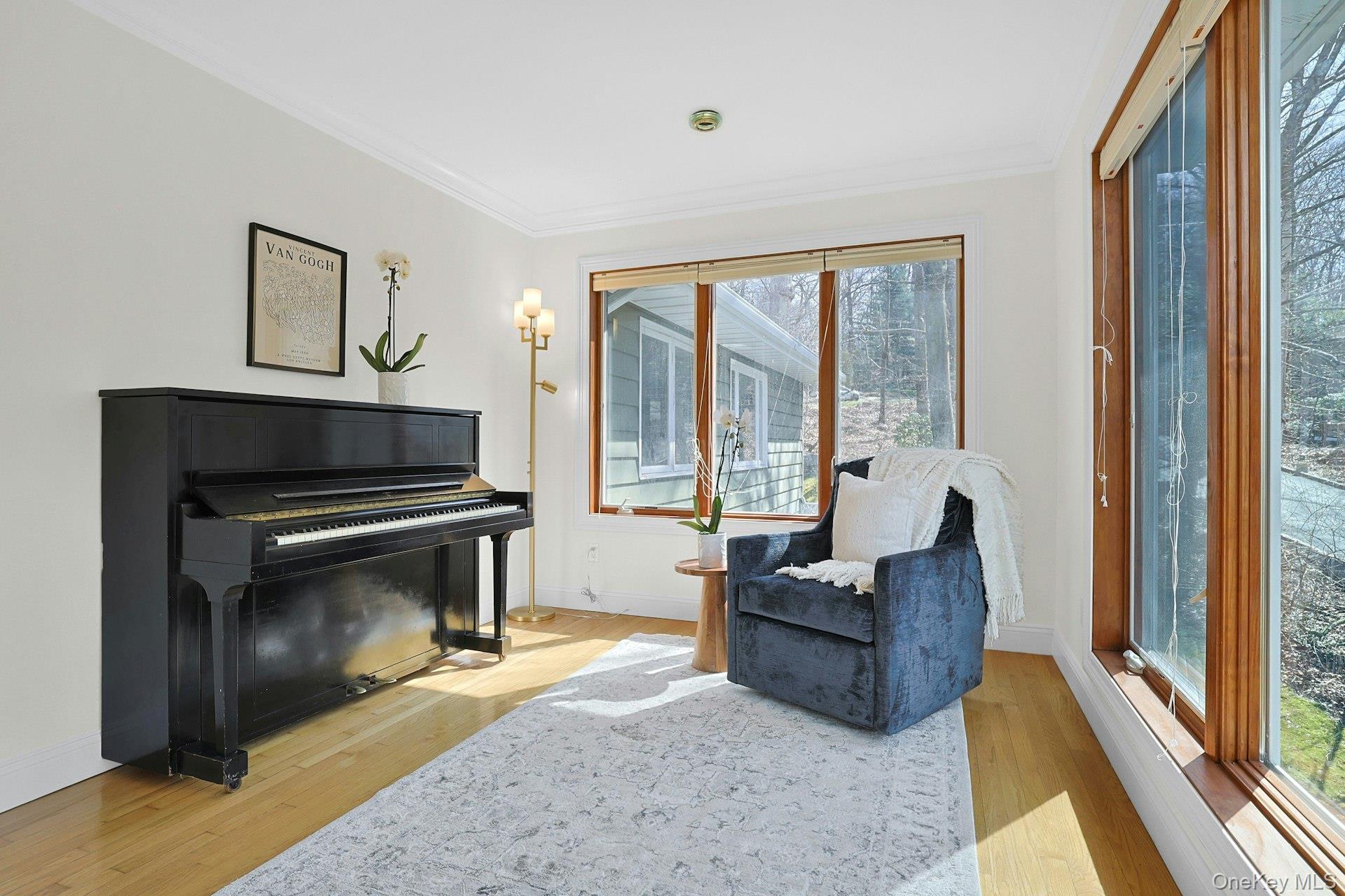 45 Sprain Valley Road Scarsdale, NY 10583 - Photo 8 of 26 Adjacent to the dining area, this versatile space is ideal for a reading or music room, again, with expansive windows that fill the room with natural light and offer peaceful views of the surrounding property.