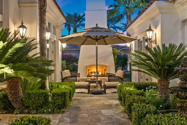 a living room with furniture large window and a flat screen tv