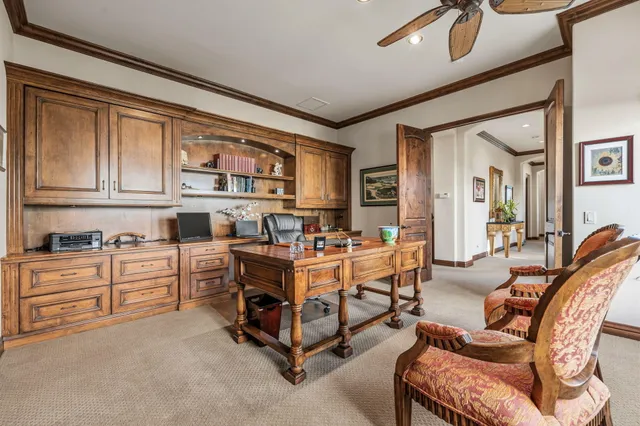 a view of a house with a yard table and chairs