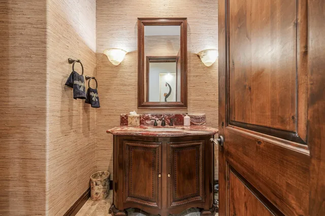 a view of a patio with table and chairs and potted plants with wooden fence