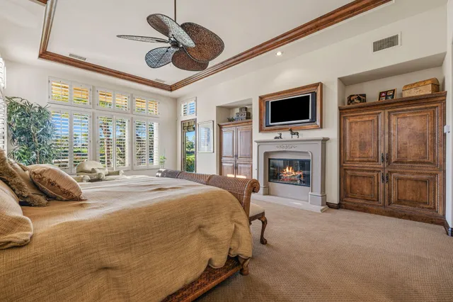 a view of a swimming pool with a table and chairs