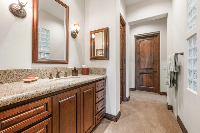 a view of a chairs and table in patio with swimming pool