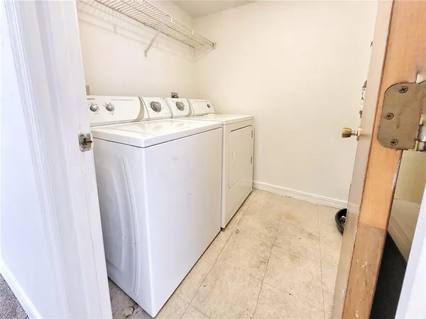 a utility room with dryer and washer