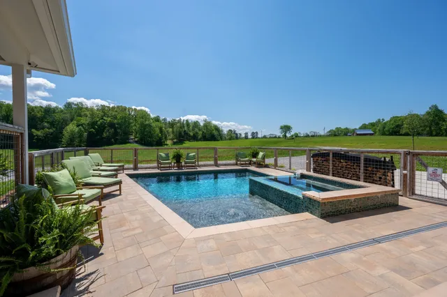 a view of a swimming pool with a patio