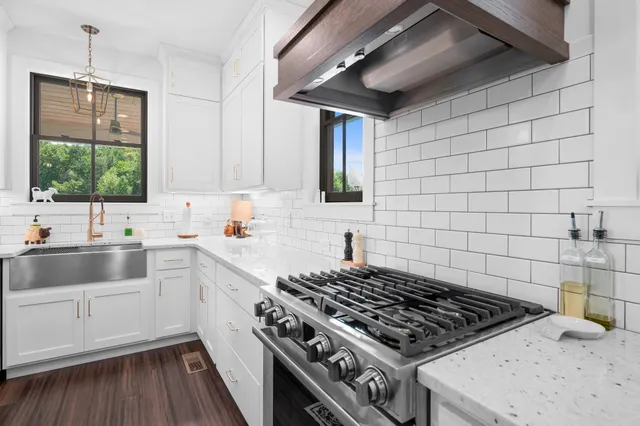 a kitchen with a sink and a window