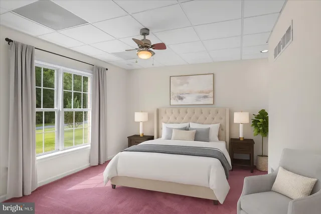 a bedroom with a large bed and a couch