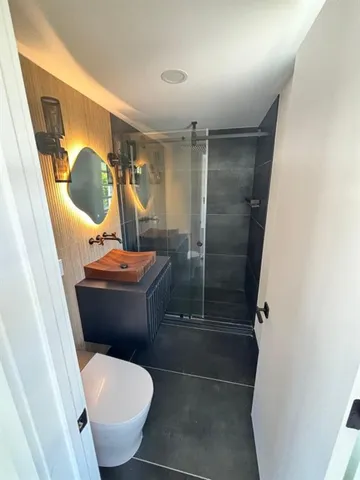 a bathroom with a toilet and a sink