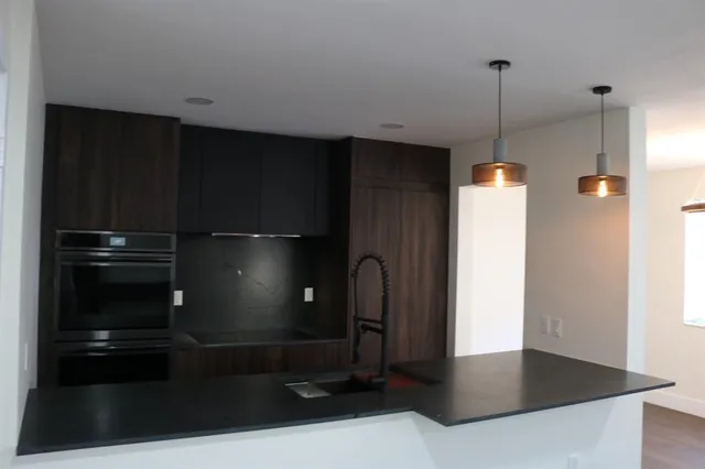 a refrigerator freezer sitting in a kitchen