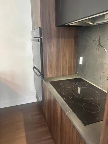 a kitchen with a sink stove and refrigerator