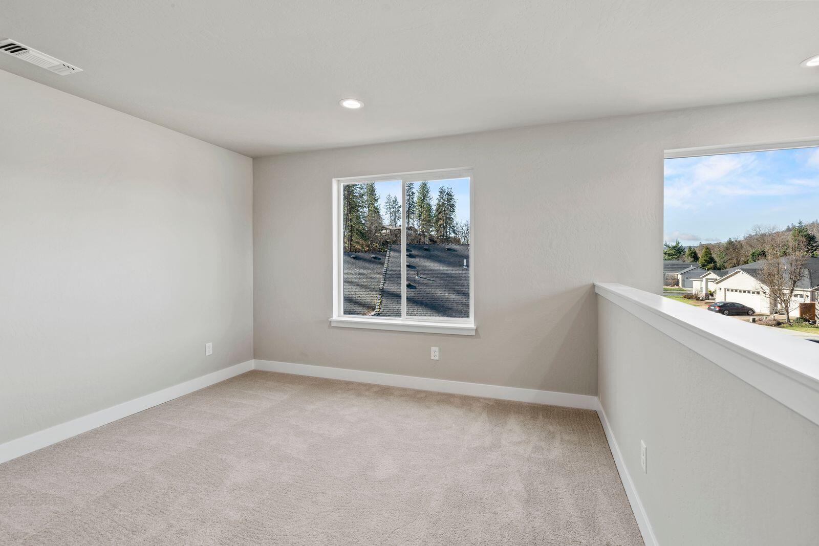 1135 Pumpkin Ridge, Unit 319 Eagle Point, OR 97524 - Photo 27 of 34 a view of an empty room with a window