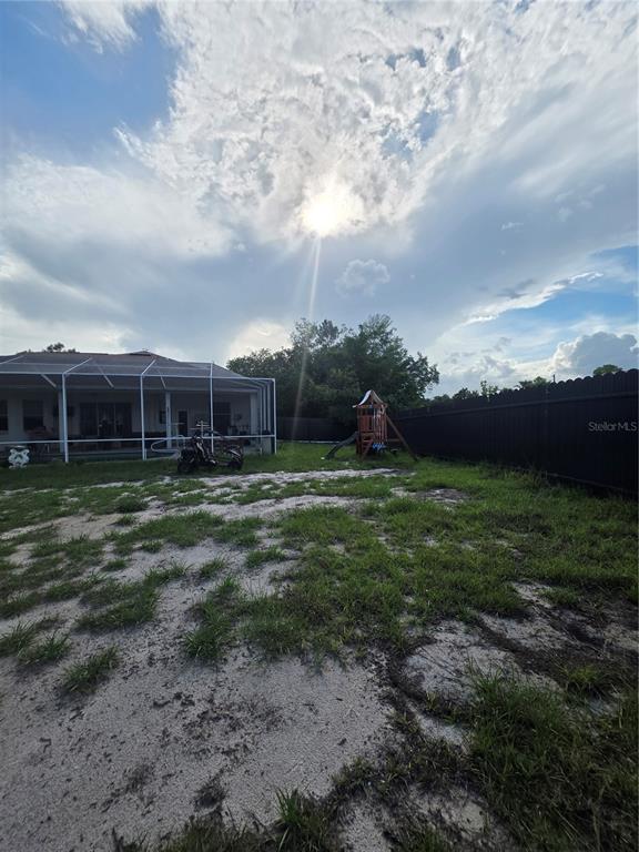 17820 Monteverde Drive Spring Hill, FL 34610 - Photo 34 of 42 a view of a house with a yard