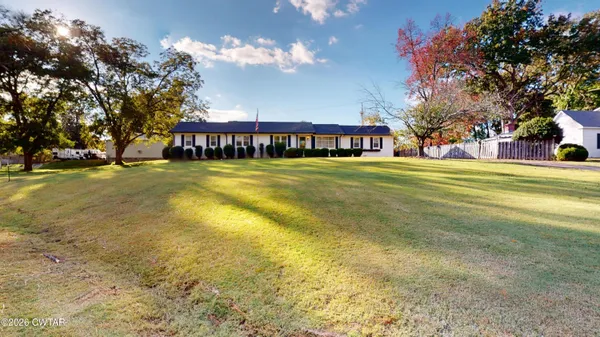 a view of a house with a big yard