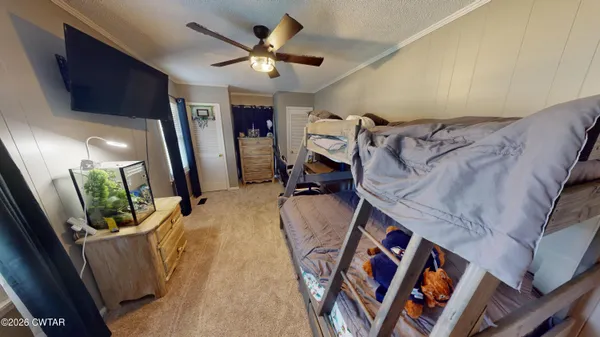a view of a livingroom with furniture and a flat screen tv