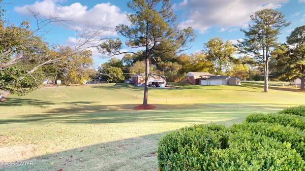 a view of a swimming pool with an outdoor space and seating area