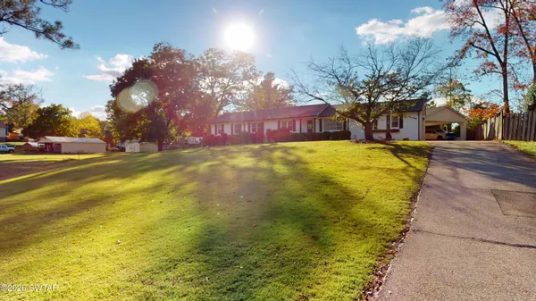 a view of a swimming pool with an outdoor space and seating area