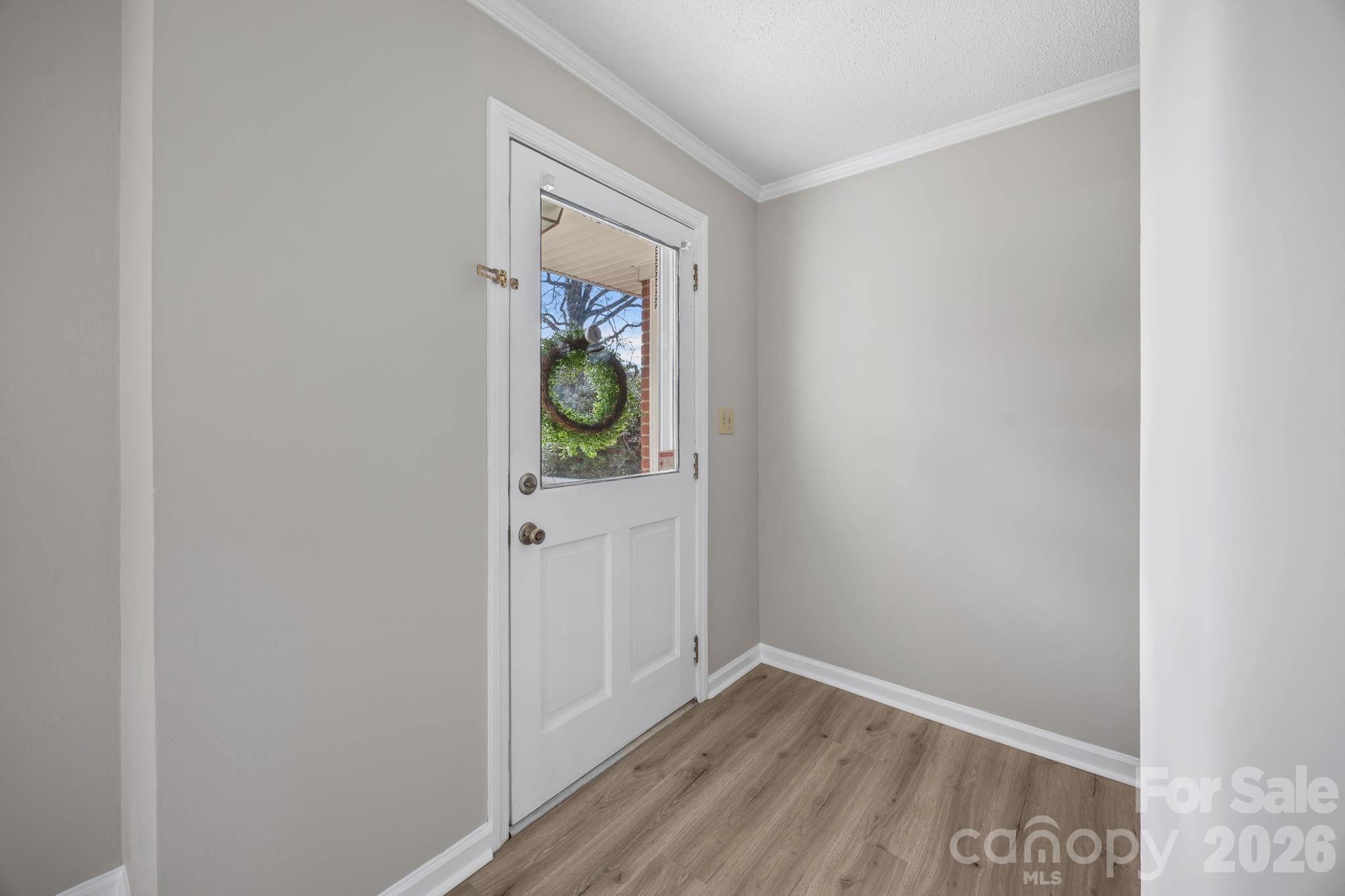 33633 Mann Road Albemarle, NC 28001 - Photo 14 of 39 a view of an empty room and wooden floor