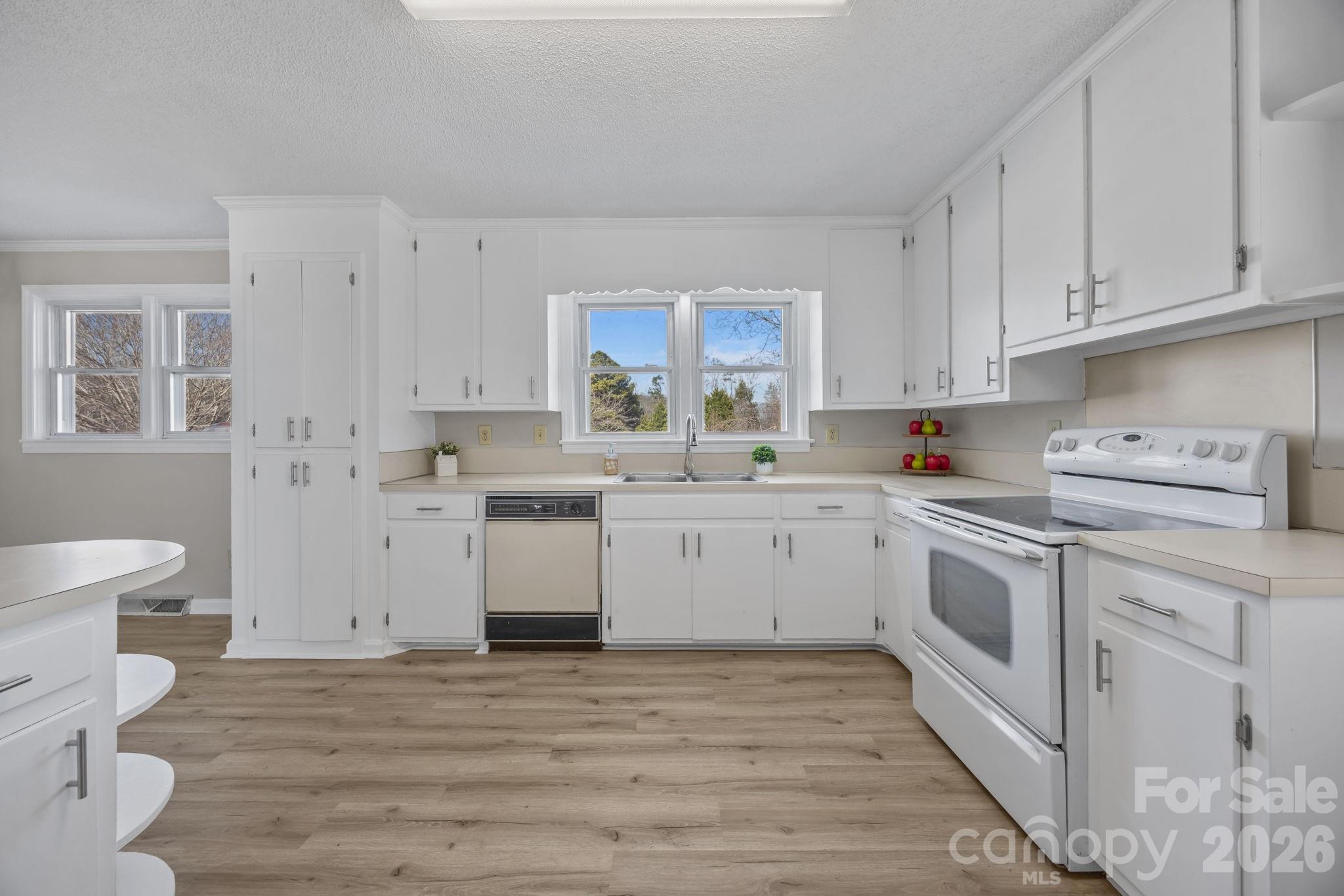 33633 Mann Road Albemarle, NC 28001 - Photo 22 of 39 a kitchen with cabinets appliances a sink and a window