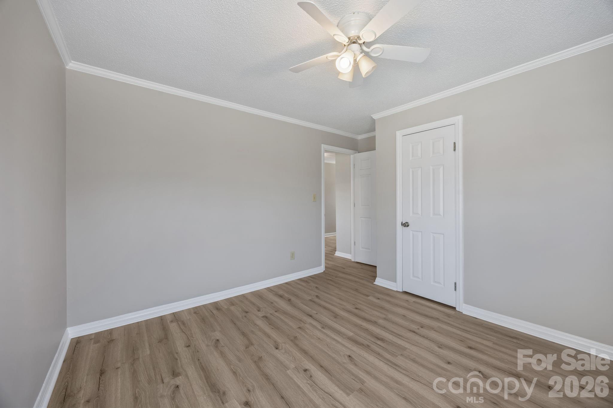 33633 Mann Road Albemarle, NC 28001 - Photo 30 of 39 a view of an empty room with wooden floor
