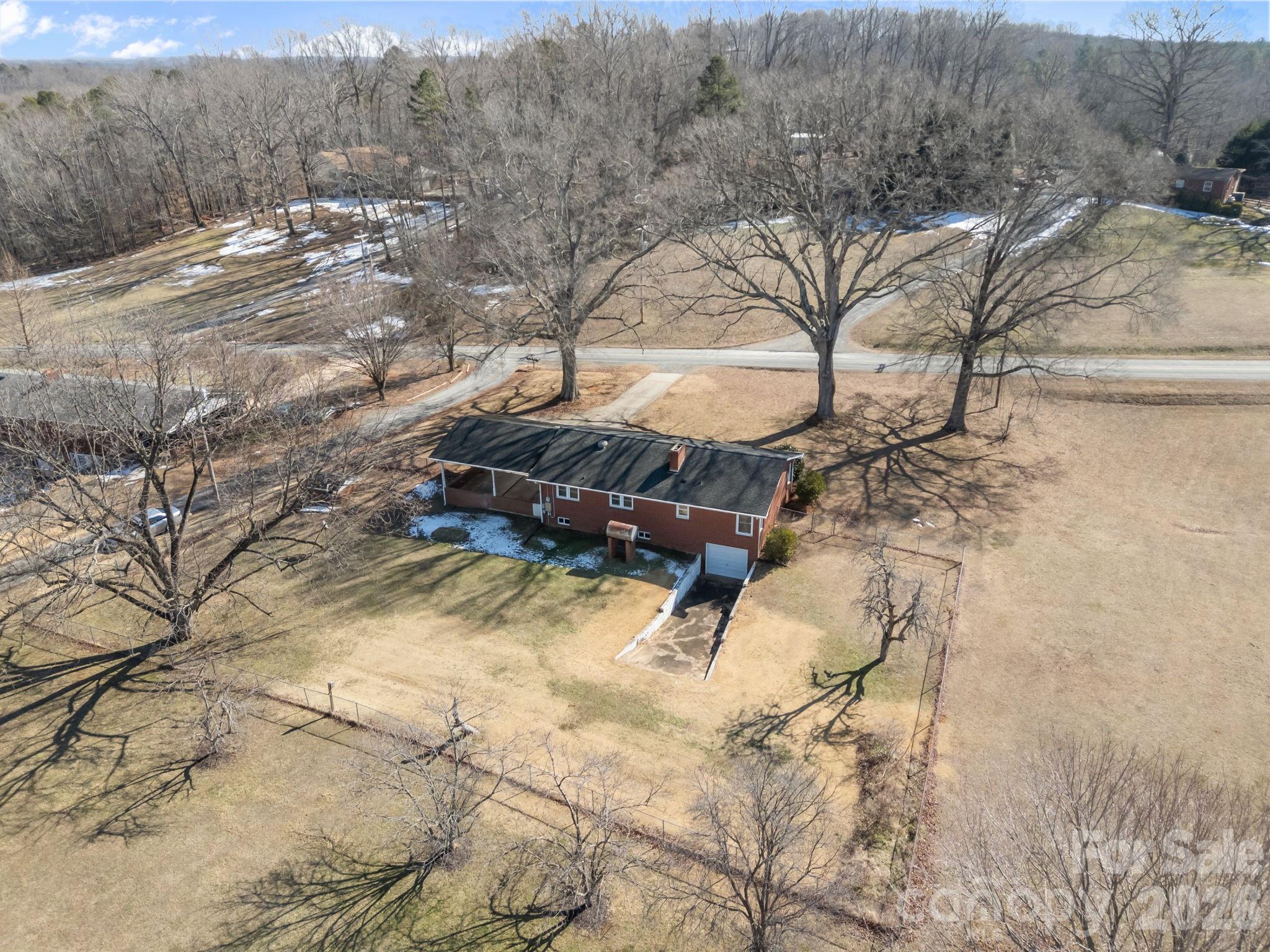 33633 Mann Road Albemarle, NC 28001 - Photo 3 of 39 a view of a yard with a tree