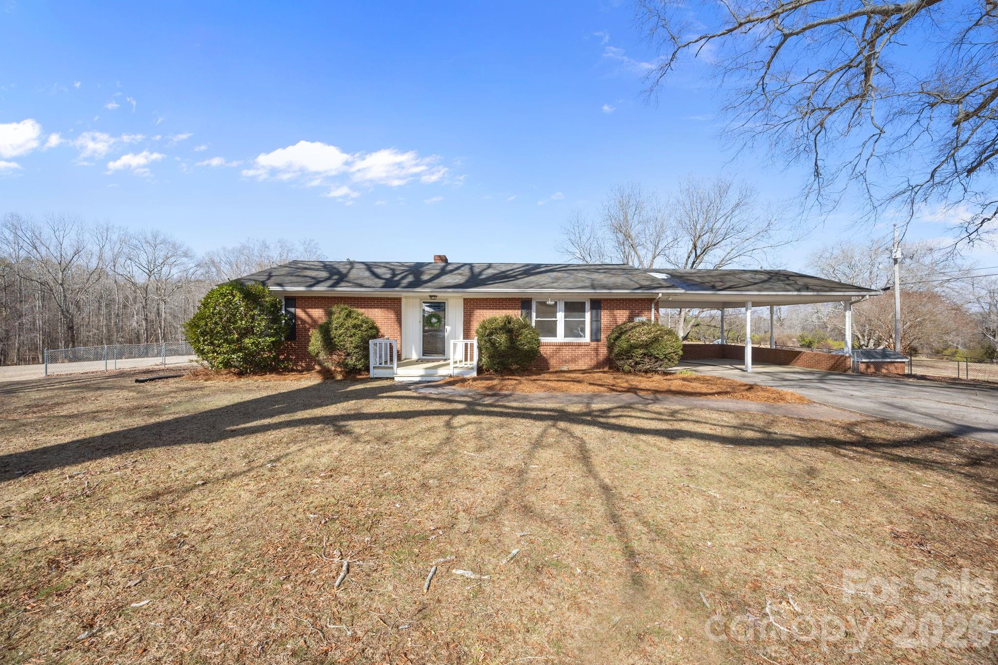 33633 Mann Road Albemarle, NC 28001 - Photo 6 of 39 a front view of a house with a yard