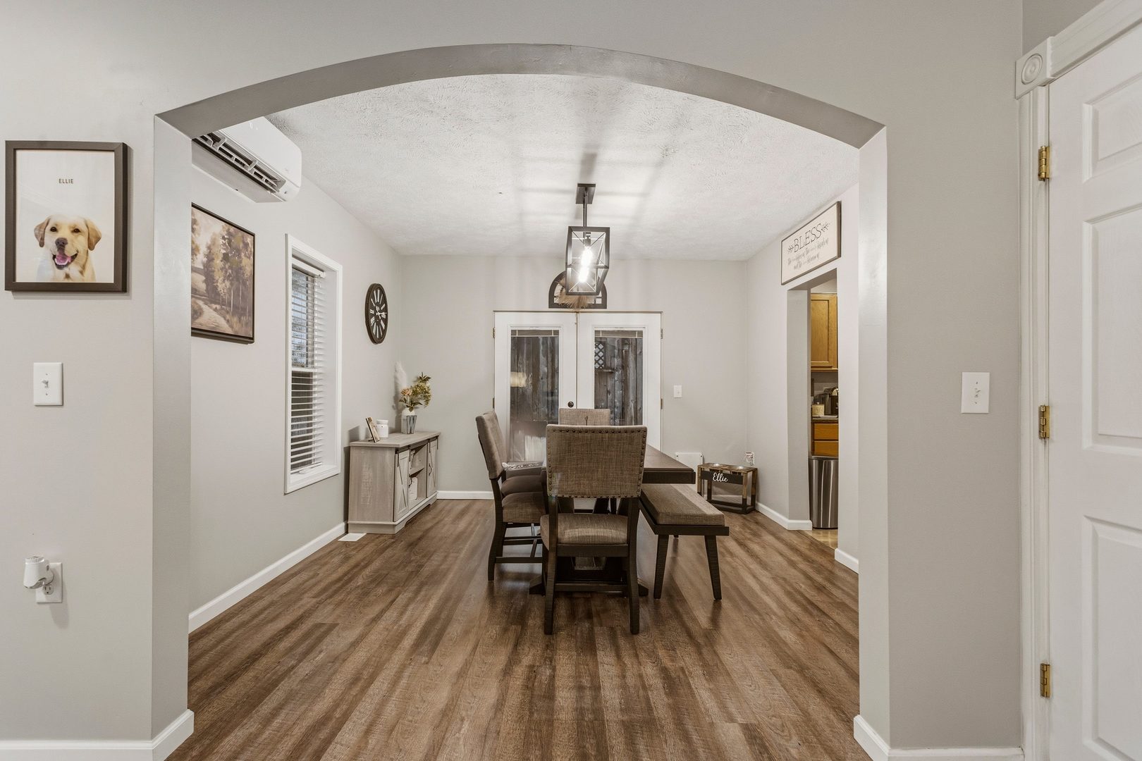 419 South Hamilton Street McLean, IL 61754 - Photo 11 of 41 a dining room with wooden floor a chandelier a wooden table and chairs