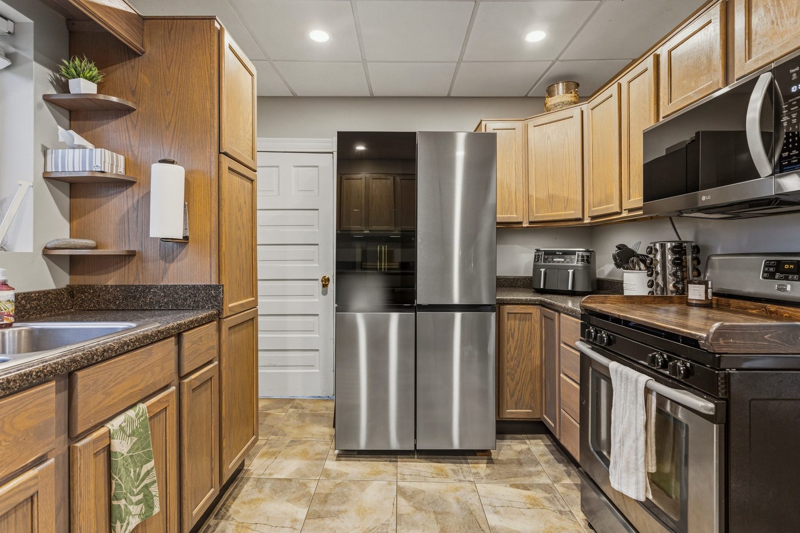 419 South Hamilton Street McLean, IL 61754 - Photo 13 of 41 a kitchen with stainless steel appliances granite countertop a stove a sink and a refrigerator