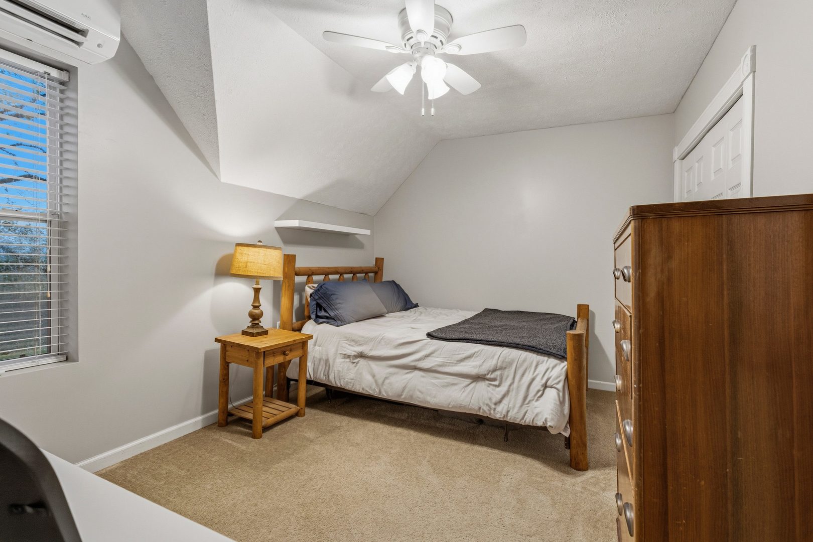 419 South Hamilton Street McLean, IL 61754 - Photo 18 of 41 a bedroom with a bed and a chandelier