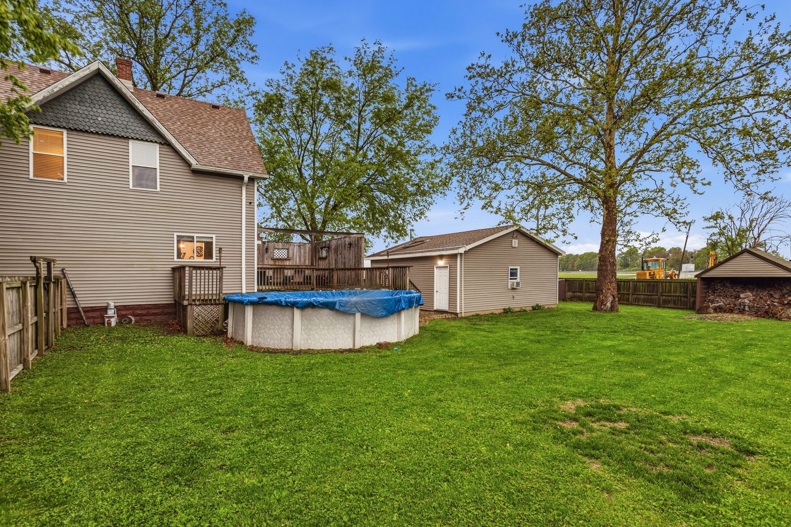 419 South Hamilton Street McLean, IL 61754 - Photo 32 of 41 a view of a house with a backyard and a tree