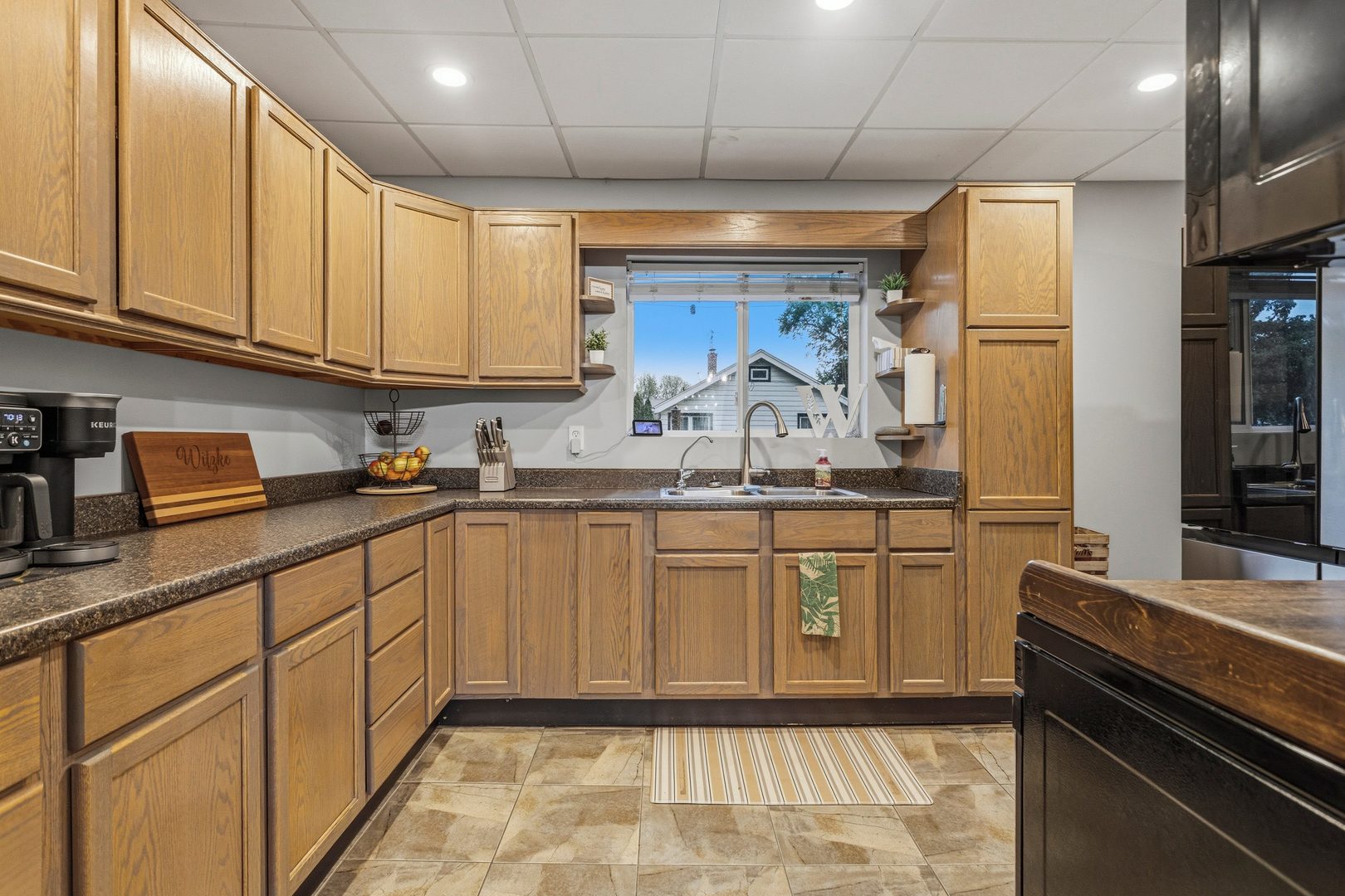 419 South Hamilton Street McLean, IL 61754 - Photo 7 of 41 a kitchen with stainless steel appliances granite countertop a sink stove and cabinets