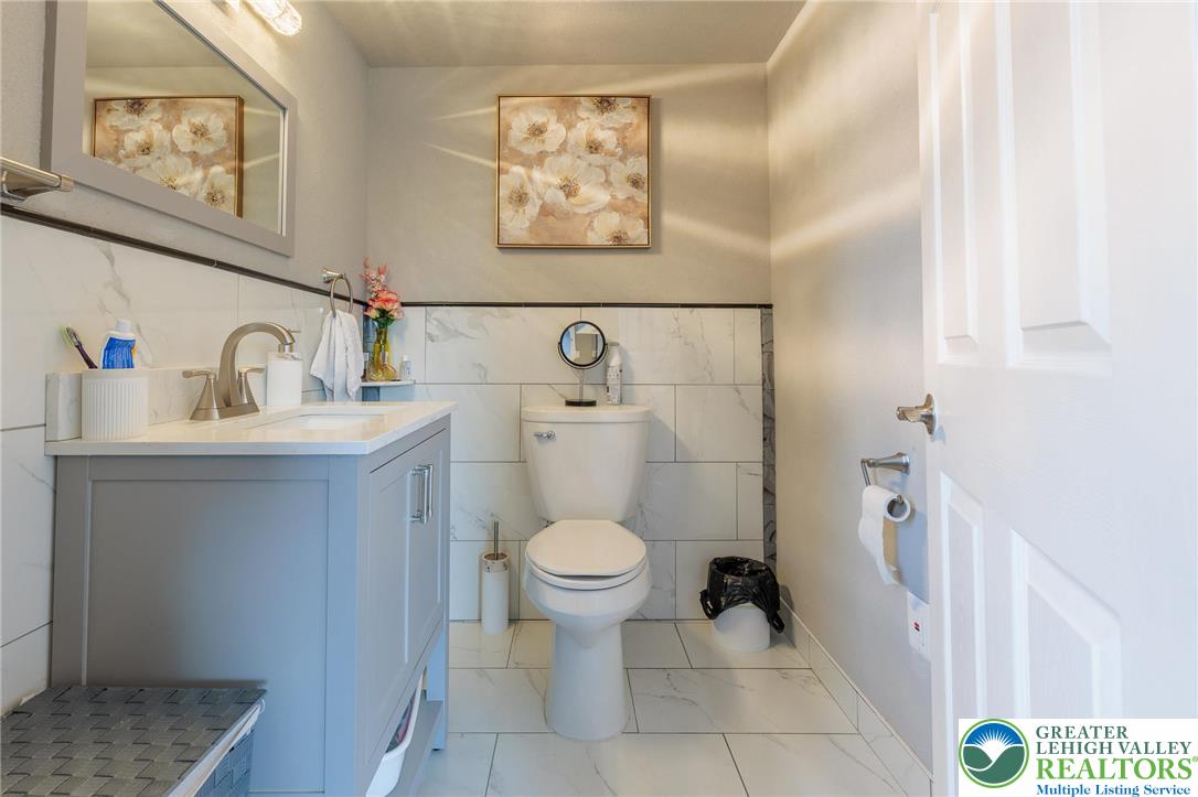 38 Water Street Wind Gap, PA 18091 - Photo 14 of 37 a bathroom with a toilet sink and mirror