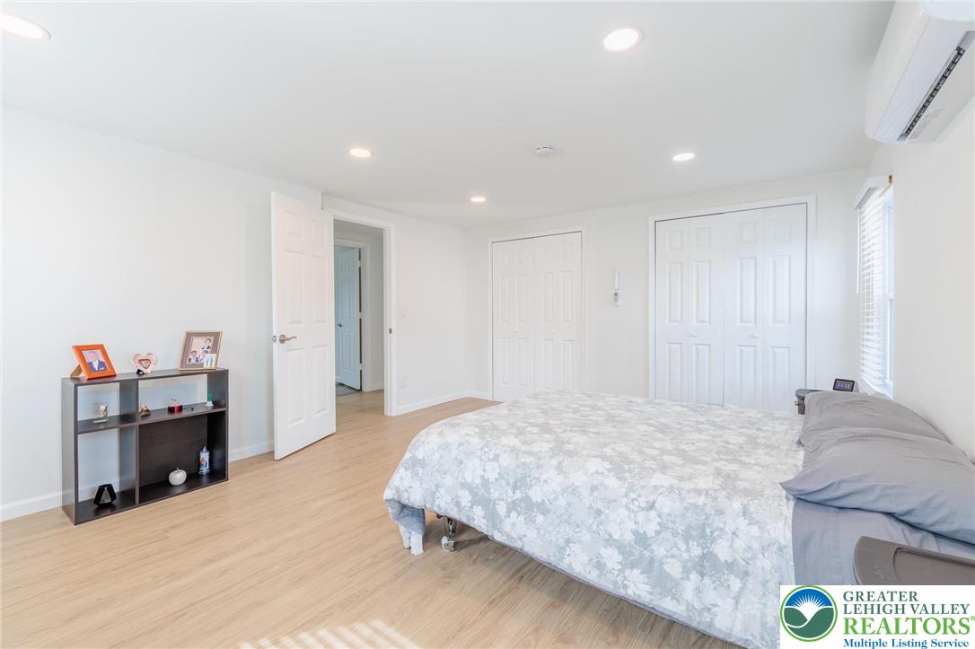 38 Water Street Wind Gap, PA 18091 - Photo 17 of 37 a spacious bedroom with a bed and a couch
