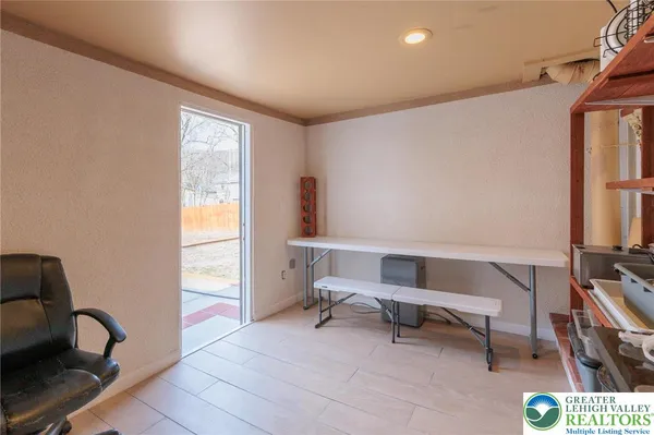 a view of a patio with a table and chairs