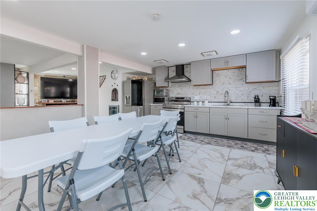 38 Water Street Wind Gap, PA 18091 - Photo 10 of 37 a large kitchen with a table and chairs in it